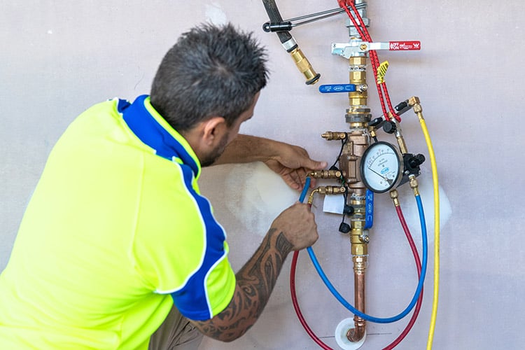 Expert plumber carrying out professional gas services